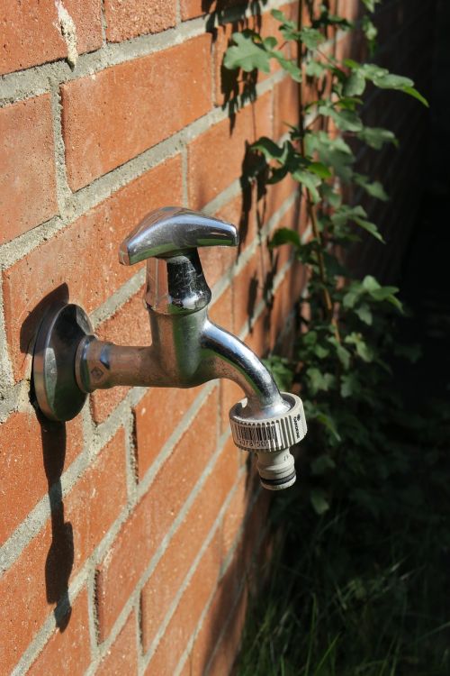 faucet brick wall bricks