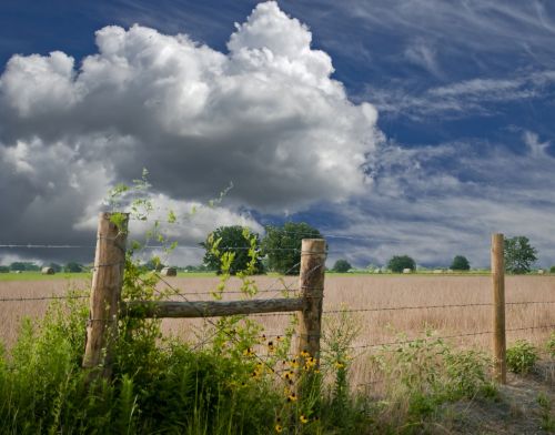 fence farmland clouds