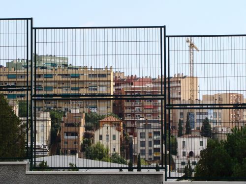 fence buildings city