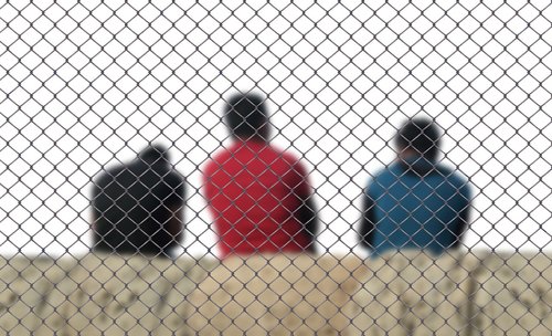 fence  men  refugee
