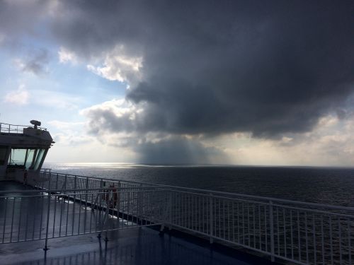 ferry heavy clouds rain
