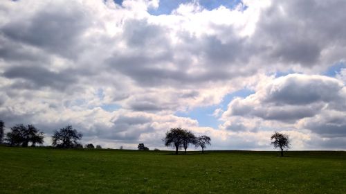 field sky clouds