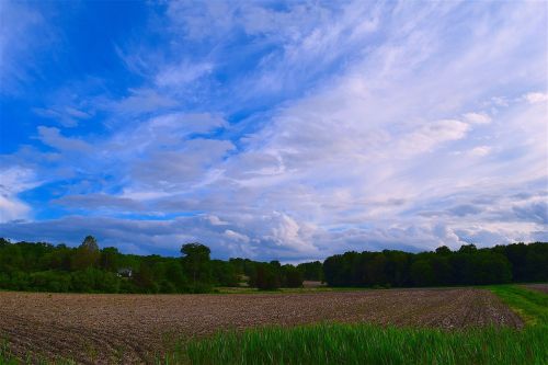 field farm cloudy sky