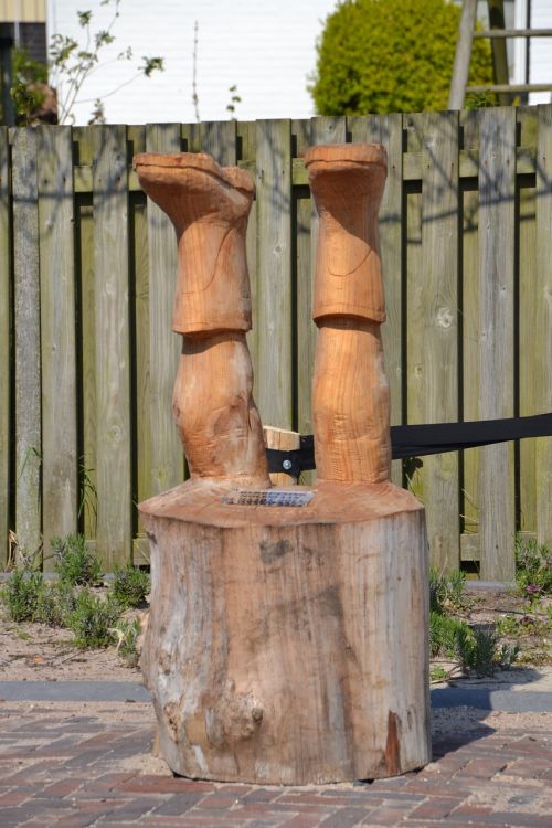 statue legs log