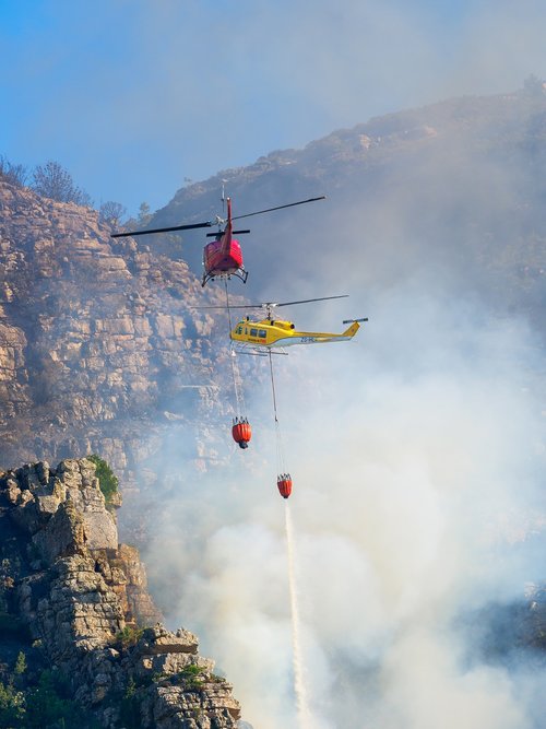 fire fighting helicopters  sky  smoke