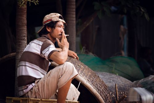 fisherman smoking asia
