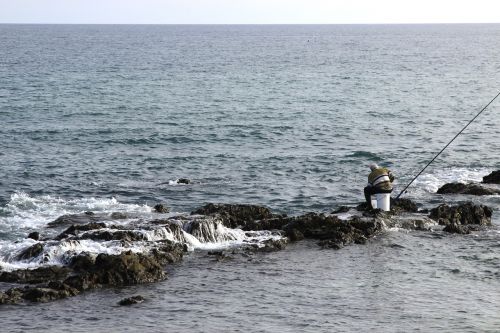 fisherman fishing mijas