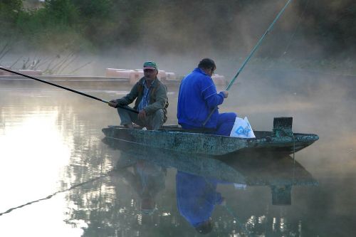 fisherman boat river fishing