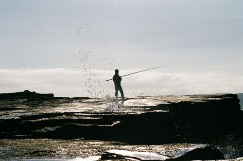 fisherman fishing fishing rod