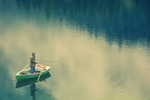 fisherman  boat  rain