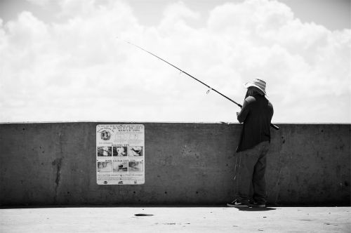 fisherman fishing rod