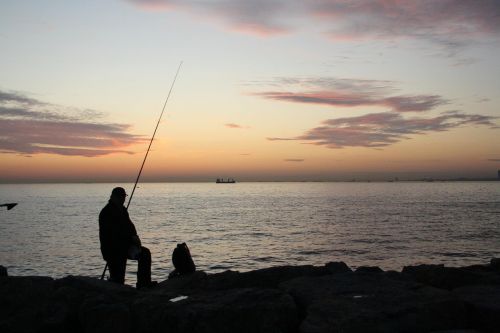 fisherman fisher sunset