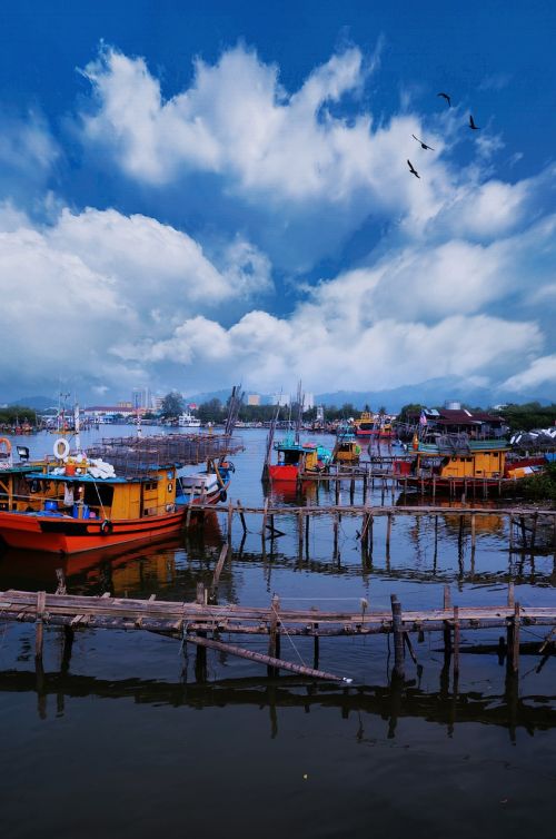 fishermen boat stream