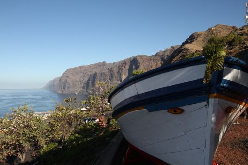 fishing boat cliff coast