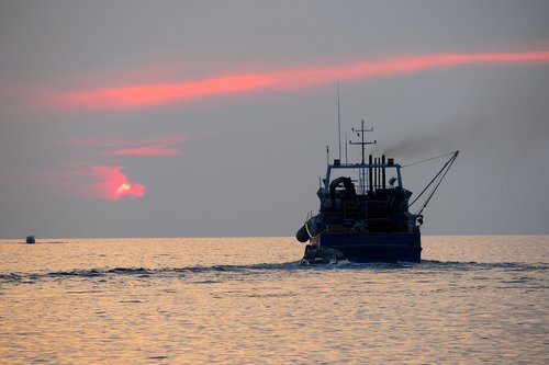 fishing boat  boat  sunset