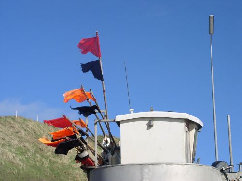 fishing boat flags sky