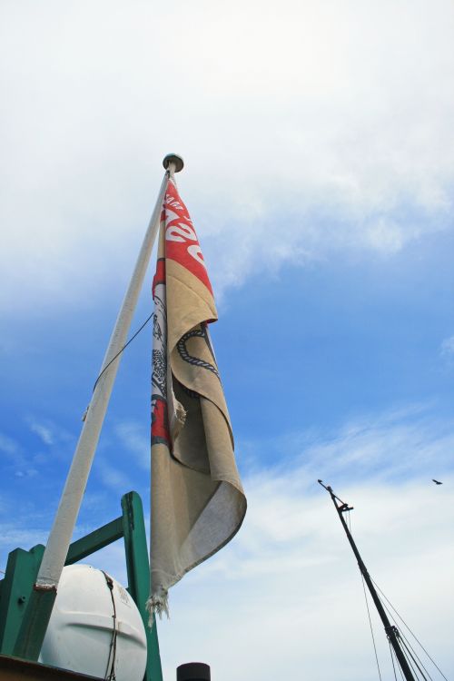 Flag On Old Tug Boat