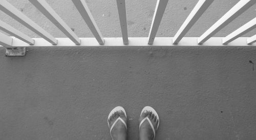 flip-flops feet balcony