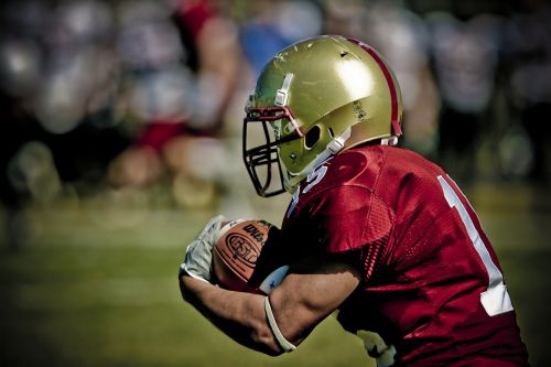 football running back gold helmet