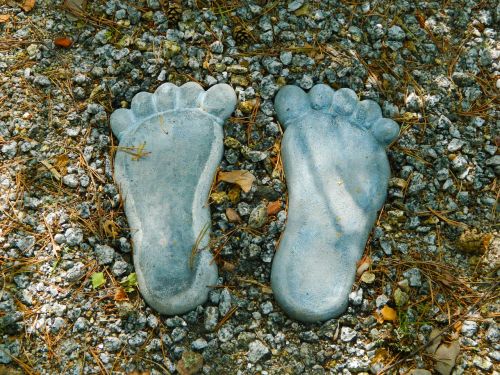 footprints stone stones