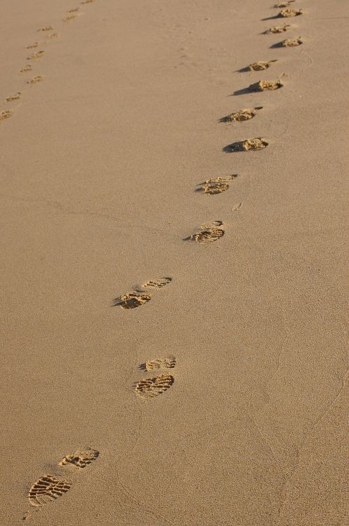 footprints sand beach