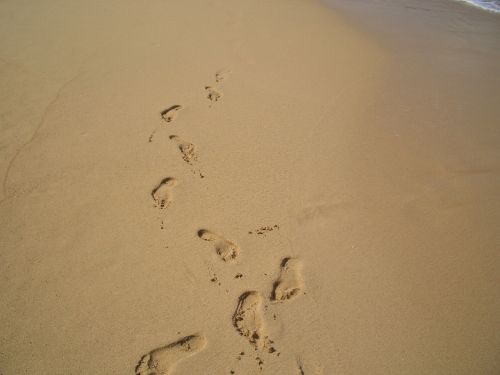 footprints sand beach