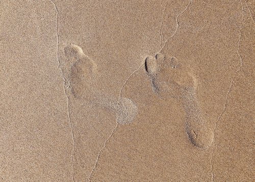 footprints  sand  beach