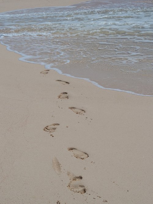 footprints  beach  ocean