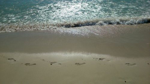 footprints sand sun