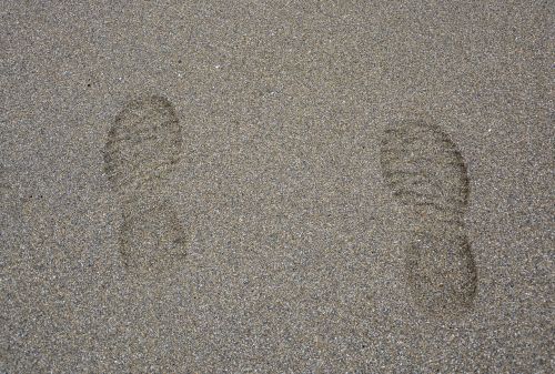 footprints feet beach sand