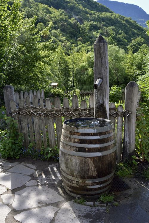 fountain wooden barrels garden