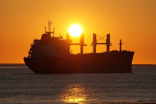 freighter  sunset  water