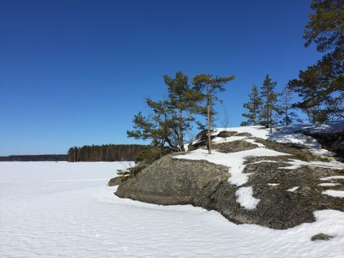 frozen lake blue sky finland