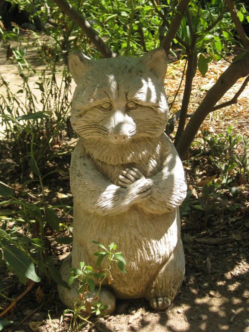 garden sculpture raccoon fox
