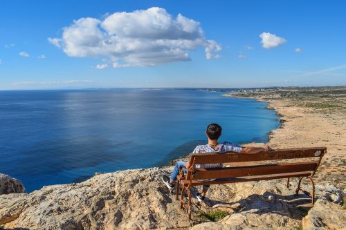 gazing at sea boy bench