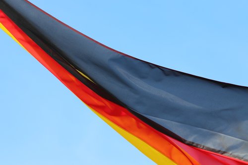 german national flag  mild wind  blue sky
