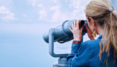 girl sea binoculars