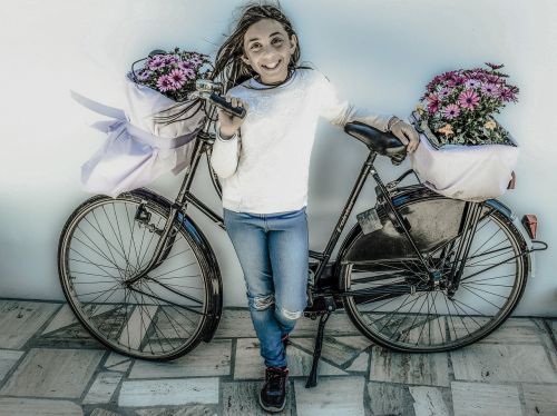girl bicycle flowers