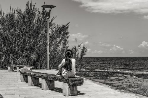 girl thoughtful by the sea