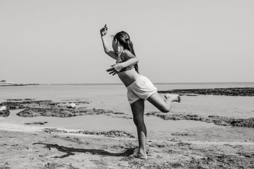 girl dancing beach