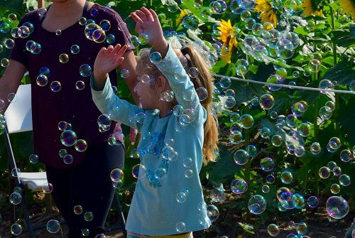 girl playing bubbles