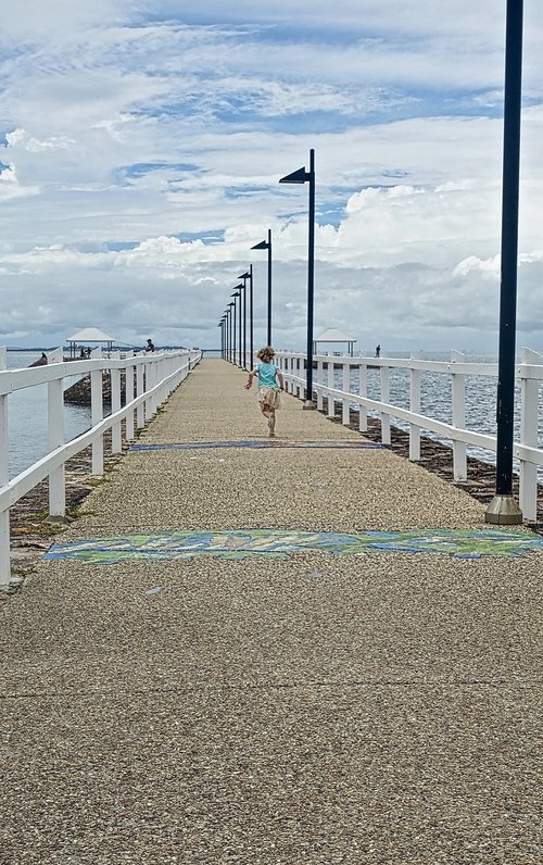 girl  running  pier