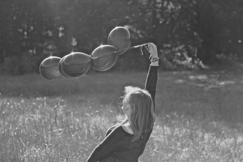 girl balloons black white