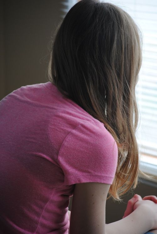 girl sitting window