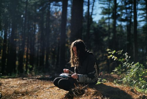 girl reading forest