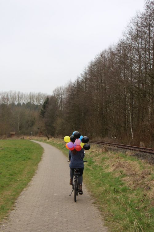 girl balloons nature