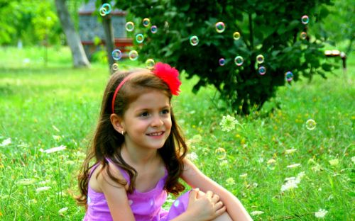 girl soap bubbles smile