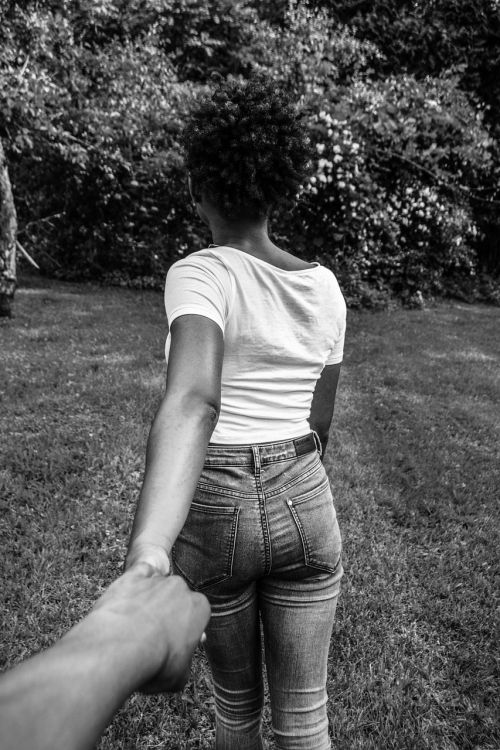 girl back holding hands
