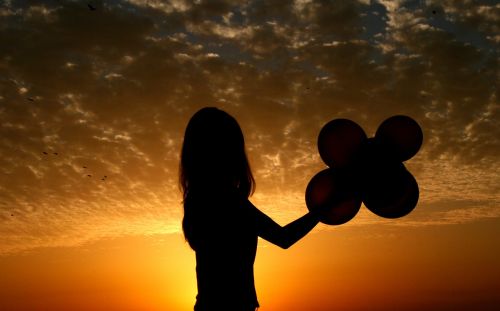 girl sunset balloons