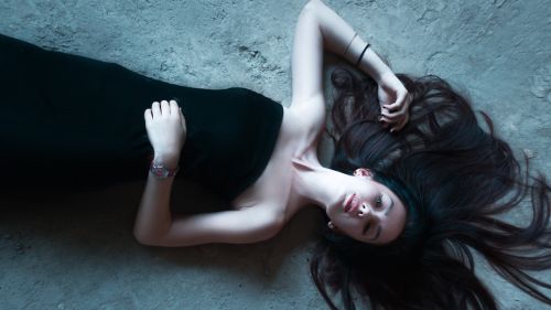 girl lying on the floor girl in dress hair
